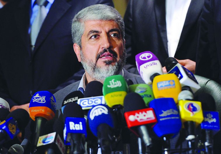 Hamas’s leader in exile Meshaal speaks during a news conference in Cairo