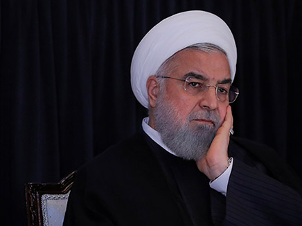 Iran’s President Rouhani listens during a news conference in New York