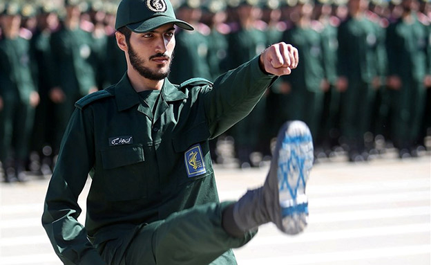 An Iranian Officer of Revolutionary Guards, with Israel flag drawn on his boots, is seen during graduation ceremony, held for the military cadets in a military academy, in Tehran