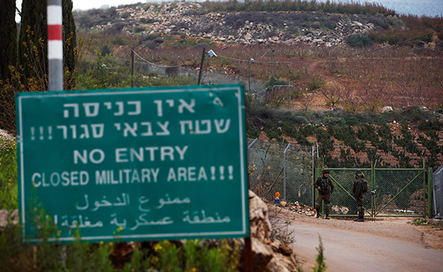 Israeli soldiers guard near the border with Lebanon, in the town of Metulla, northern Israel