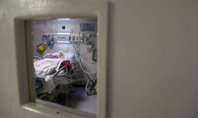 An Iranian patient suffering from COVID-19 lies in bed at a hospital as the coronavirus disease (COVID-19) cases spike in Tehran