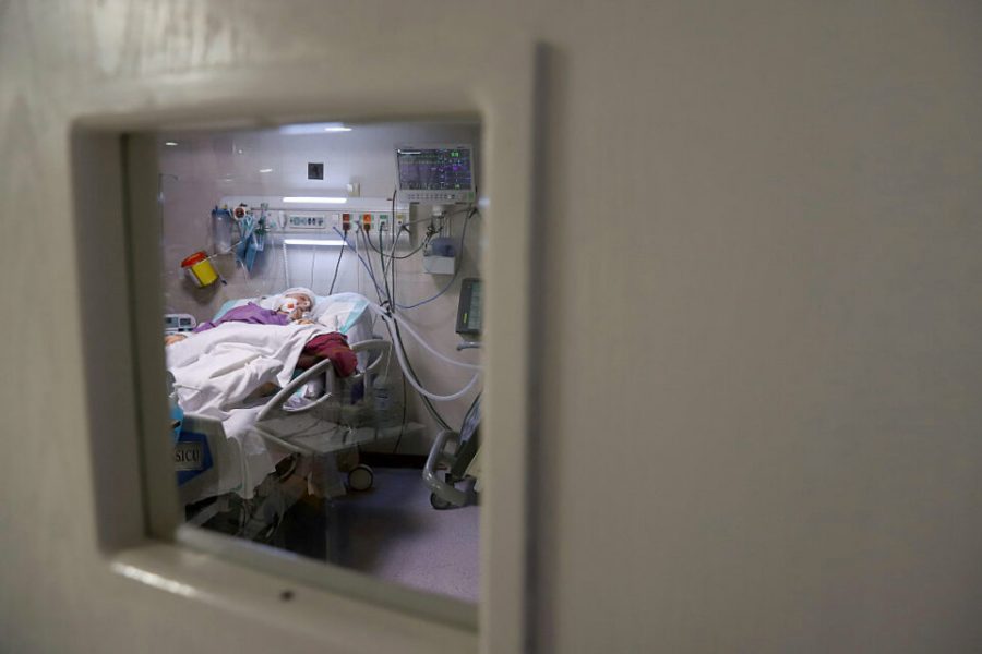 An Iranian patient suffering from COVID-19 lies in bed at a hospital as the coronavirus disease (COVID-19) cases spike in Tehran