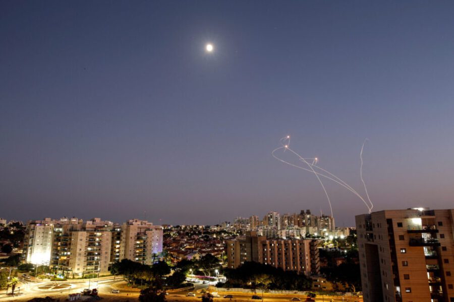 Streaks of light are seen as Israel’s Iron Dome anti-missile system intercept rockets launched from the Gaza Strip towards Israel, as seen from Ashkelon