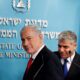 FILE PHOTO: Israeli Prime Minister Netanyahu and Finance Minister Lapid leave after a joint news conference in Jerusalem