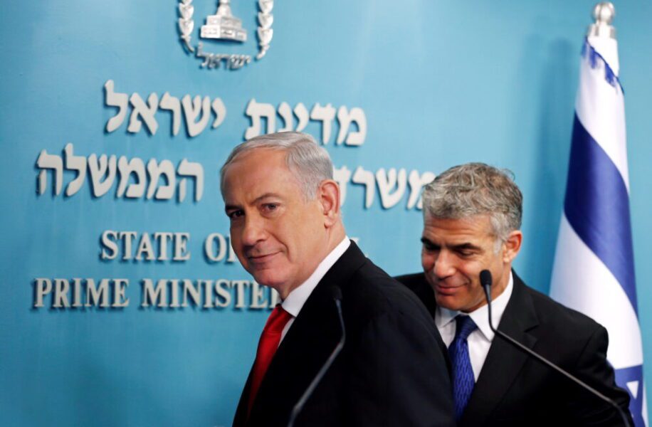 FILE PHOTO: Israeli Prime Minister Netanyahu and Finance Minister Lapid leave after a joint news conference in Jerusalem