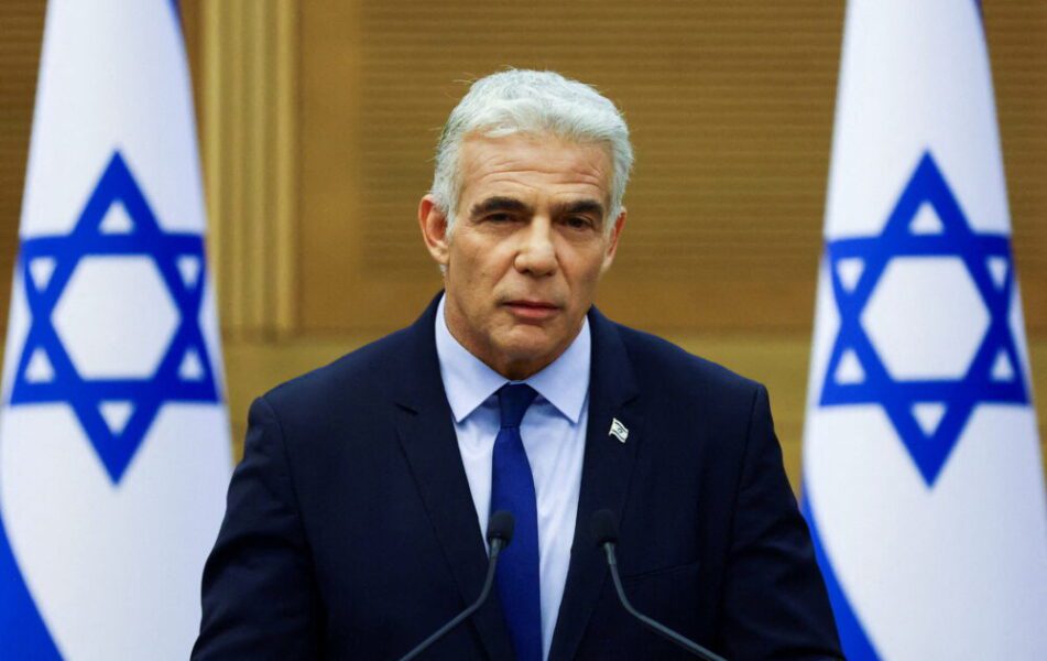 FILE PHOTO: Israeli Prime Minister Naftali Bennett and Foreign Minister Yair Lapid give a statement, in Jerusalem
