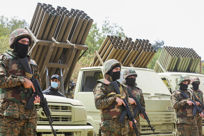 Hezbollah members take part in a military exercise during a media tour organized for the occasion of Resistance and Liberation Day, in Aaramta