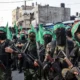 231009-gaza-city-hamas-fighters-masks-weapons-2017-ac-1108p-1bb51e