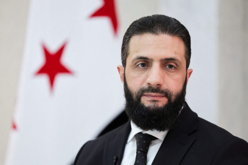 Syria’s interim President Ahmed al-Sharaa attends an interview with Reuters